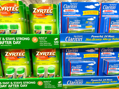 Zyrtec and Claritin allergy OTC medication on display inside Costco warehouse.