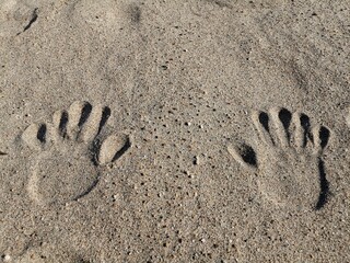 handprints in sand