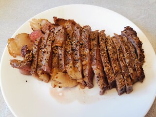 grilled sliced steak on a plate