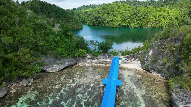 INDONESIA - 9.4.2024 - Wonderful aerial footage moving over Indonesia's Jellyfish Lake, where tourists are swimming.