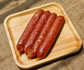 side view, group chinese sausage on wooden board