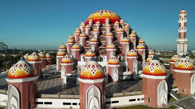 INDONESIA - 9.4.2024 - Beautiful aerial footage circling clockwise around the 99 Domes Mosque in Makassar, Indonesia.