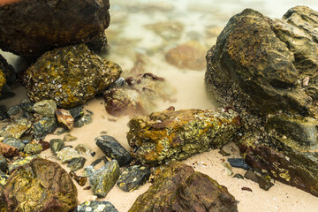 Long exposure photo of Nature’s Harmony: Rocks and Waves in Perfect Balance.