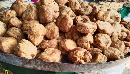 Indian sweet Food - Khurma is a traditional Indian sweet snack. Khurma is a piece of fried flour which has been coated with sugar. also names called sweet tikiya, mitha chap, 