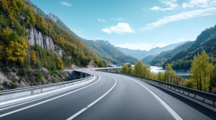 Fototapeta premium Scenic Highway Curving Through Serene Mountain Landscape