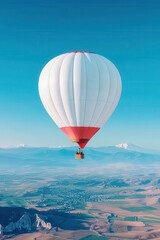 Vintage hot air balloon flying over a scenic landscape