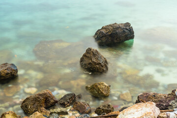 Long exposure photo of Nature’s Harmony: Rocks and Waves in Perfect Balance