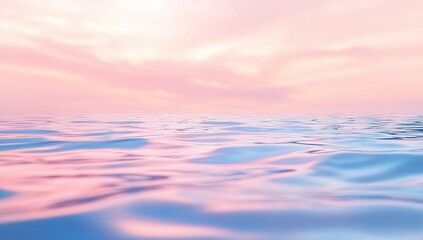 Obraz premium A photograph of soft, pastel-blue water ripples with a pink sky background