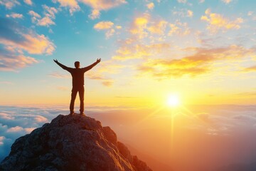 Person Standing on Mountain Peak at Sunrise