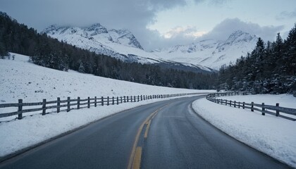 Road by snowcapped mountains against clear sky
5
