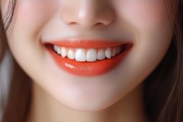 Fototapeta premium A close-up portrait of a cheerful Asian woman, focusing on her mouth and her radiant teeth