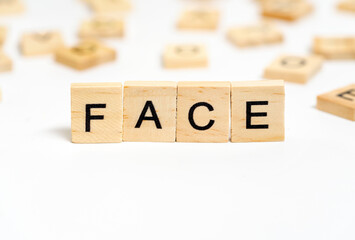 Word Face Formed with Wooden Blocks