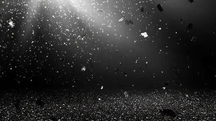 Obraz premium Abstract image of floating particles in a dark environment with light rays.