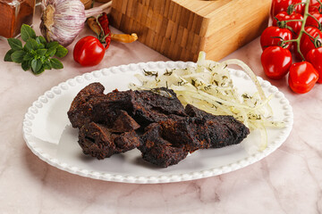 Grilled beef barbecue served onion