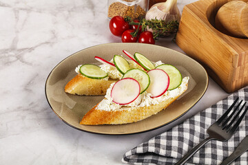 Bruschetta with soft cheese and radishes