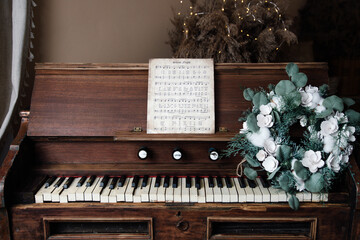 Vintage piano decorated for Christmas