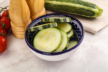 Raw green zucchini slices for cooking