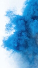 Naklejka premium A vibrant blue smoke cloud against a light background, creating a dynamic visual effect.