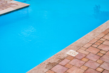 Poolside with metal railings and calm water