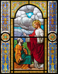 VOGHERA, ITALY - SEPTEMBER 12, 2024: The Jesus consigning the keys to Peter in the stained glass of...