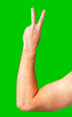human arm gesturing with raised fingers against a bright green backdrop
