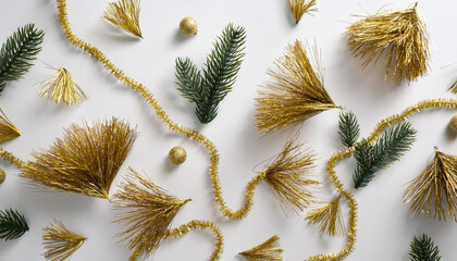 A white background with gold and silver decorations including stars, ornaments, and a ribbon. The decorations are arranged in a way that creates a festive and celebratory mood