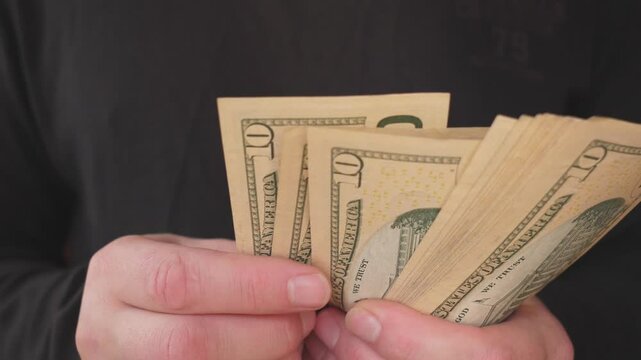 ten-dollar banconte men's hands slow motion