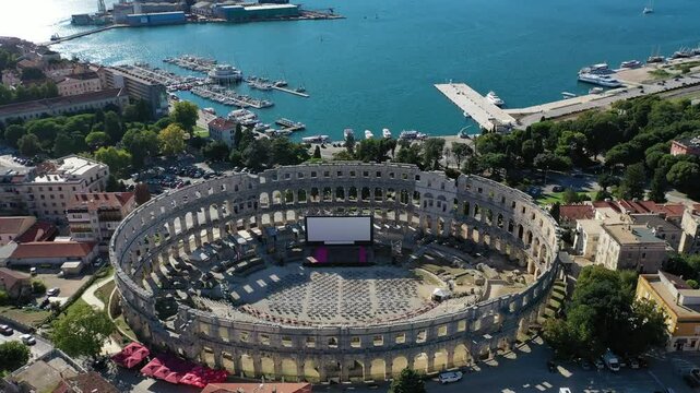 Full Aerial view of a Roman Amphitheater Colosseum near the sea