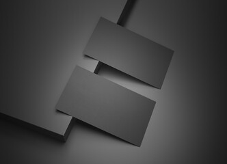 Two black business card Mockup. Textured calling card template on a dark surface. 3D rendering