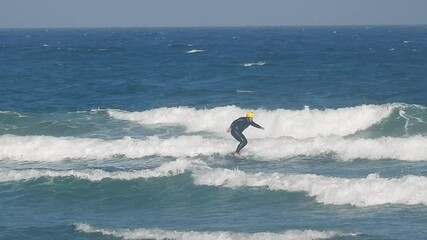 Fast foiler on ocean waves, elevated by a hydrofoil with strong wind, flying the surface at high speed, creating spray and dynamic energy. very fast - Powered by Adobe