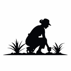 A silhouette of a farmer or gardener working in a field or garden