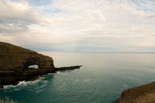 Hole in the Rock at Akaroa Head Scenic Reserve Cliffs - Dramatic Coastal Formation