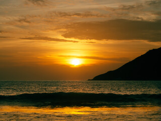 Serene Sunset Over Ocean Waves at Dusk