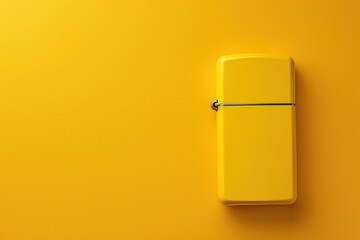 Yellow lighter on a bright yellow background