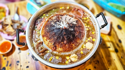 Burnt Pan, Close up of burned Thai grilled BBQ pan. Pan is full of foods stains Carcinogen and cancer. Dirty Pan