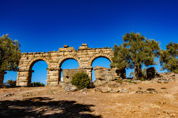 Alinda, located in the region of Karia, in the present-day Karpuzlu district of Aydın province, has well-preserved remains of an ancient theater, agora, aqueducts, and city walls.