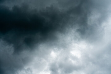 Dark dramatic storm cumulus clouds in autumn. An impending storm, hurricane or thunderstorm. Bad weather.