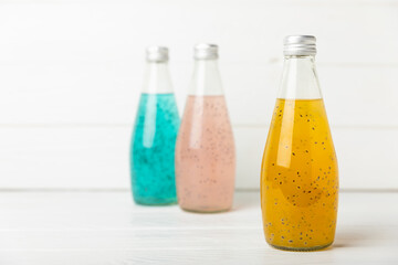 Diet detox cocktail with basil and chia seeds in a glass jar and a glass on a textured background. Drink with seeds. Health food. Detox cocktail. Antioxidant. Water with basil. Space for text. 