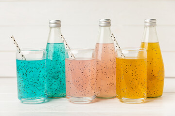 Diet detox cocktail with basil and chia seeds in a glass jar and a glass on a textured background. Drink with seeds. Health food. Detox cocktail. Antioxidant. Water with basil. Space for text. 