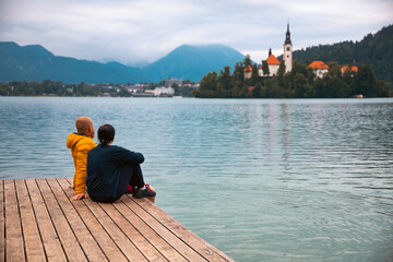 Couple in love looking at Bled Lake. Slovenia, Europe.