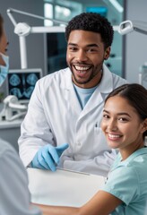 A male and female dentist smiling with a female patient in the dental chair, all in a modern dental clinic.