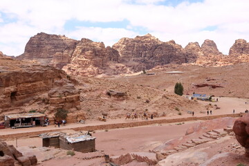 Petra, Wadi Musa, Jordan - May 13 2024: people riding camels adorned with colourful blankets at the...