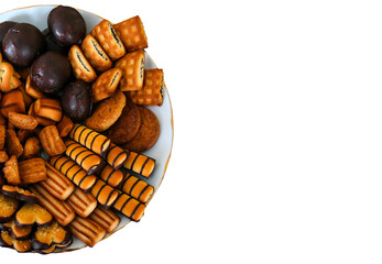 A delicious assortment of cookies and snacks arranged on a plate for a delightful afternoon treat at a cozy gathering