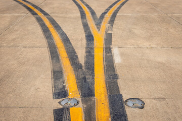 Direction lines on an airport runway tarmac	