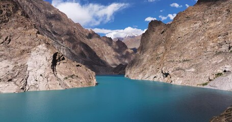 Stunning Aerial View Above Attabad Lake in Hunza Valley, Pakistan, Bright Blue Waters Surrounded by Towering Mountains. Summer Day in Nature.