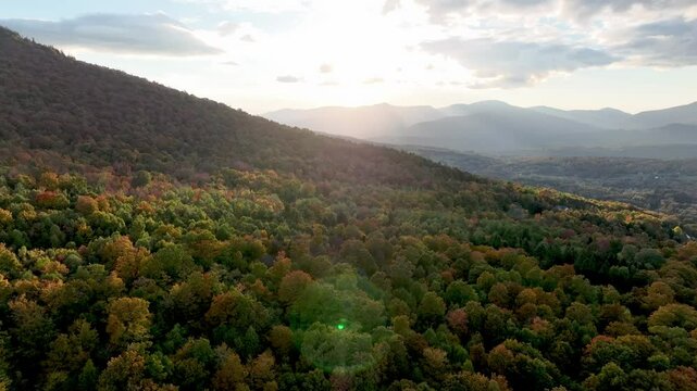 aerial push into sunset with leaf color near stowe vermont