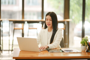 Business woman working on documents, graphs