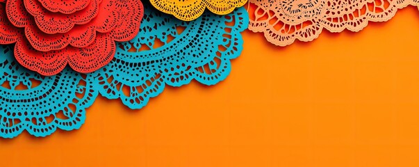 Obraz premium Colorful lace decorations on a vibrant orange background, perfect for crafts, scrapbooking, or festive designs.