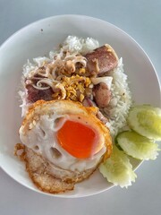 Rice topped with stir-fried seafood and basil, Rice topped with stir fried minced pork and basil with Fried egg