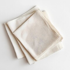 A set of organic cotton napkins on a white background.